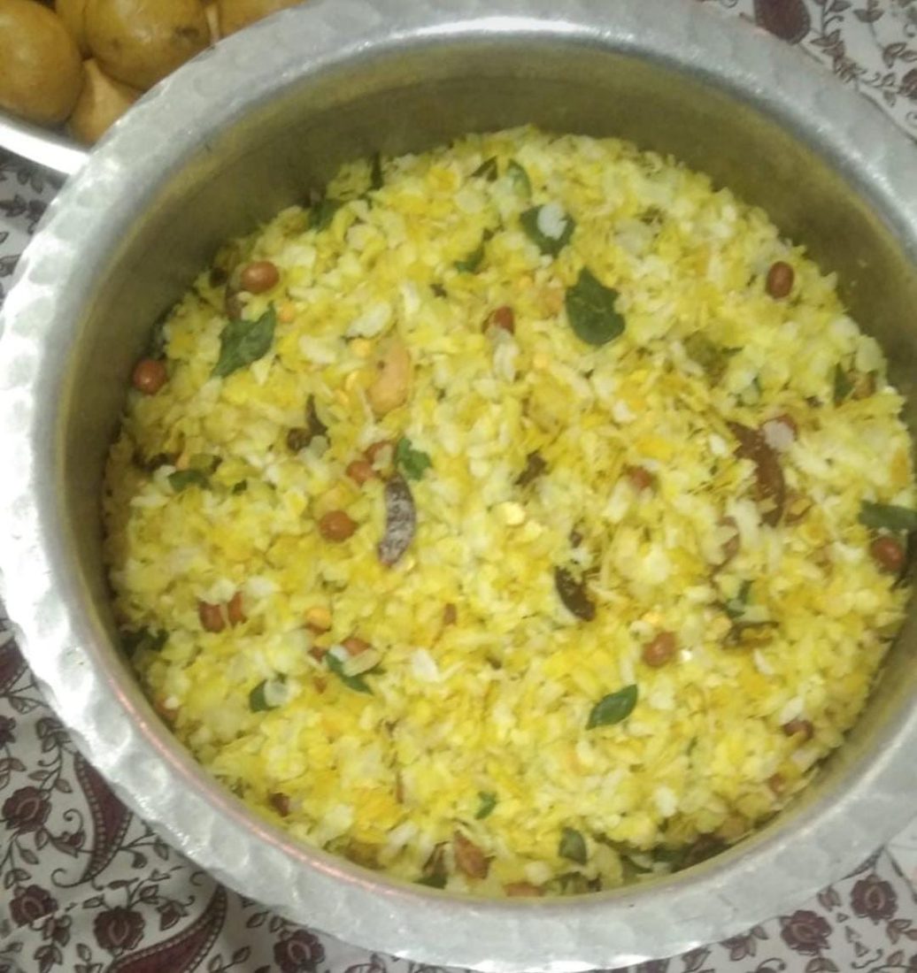 Homemade poha chivda in a mixing bowl