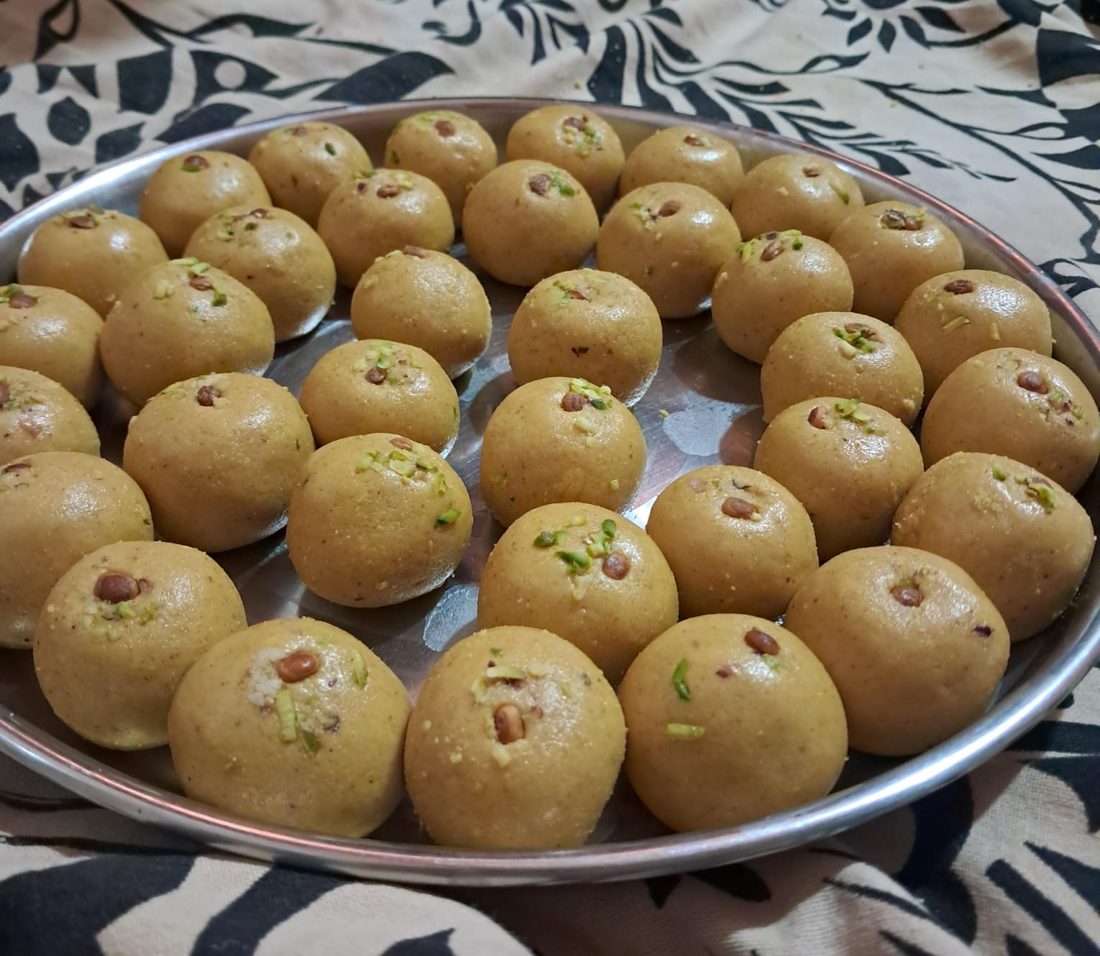 Freshly made ladoos, neatly arranged and ready